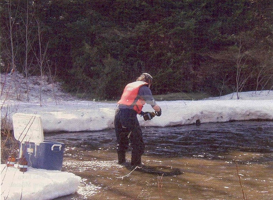Fig 2. Researcher is sampling for Hg during moderate snowmelt flow at the mixed land-use catchment